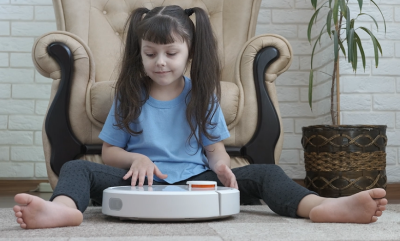 girl with robot vacuum